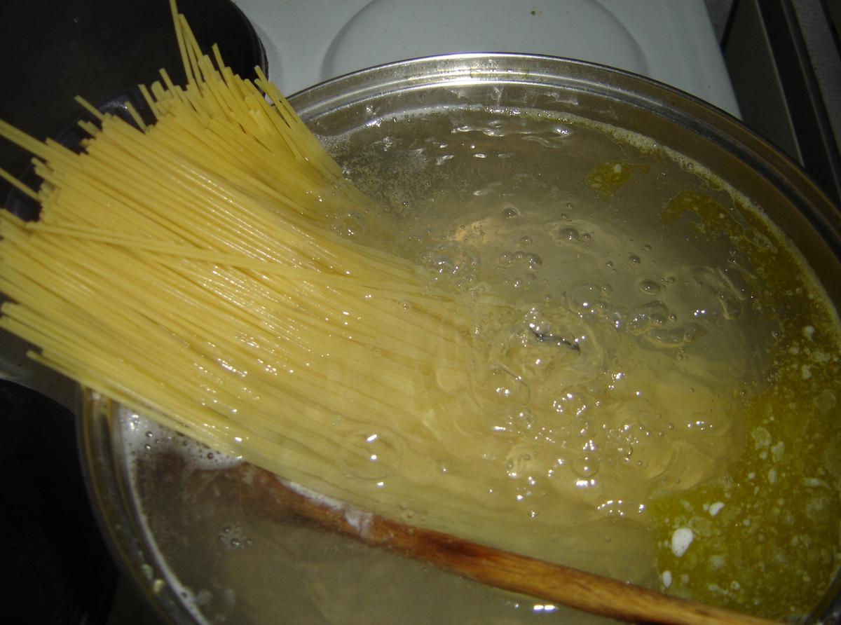 Pasta cooking in a pot of boiling salted water