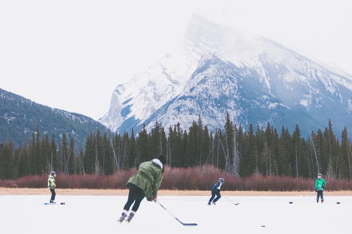 Image depicting ice hockey players engaged in a game