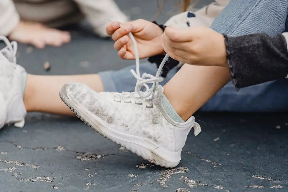 A child tying shoelaces using the bunny ear shoelace tying method.