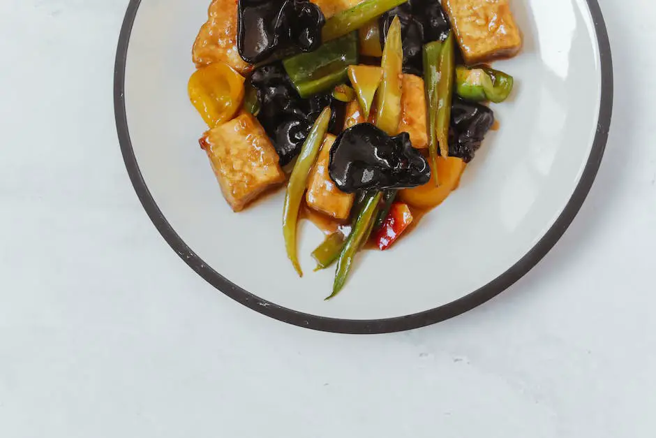 A picture of a chef preparing tofu in a wok.